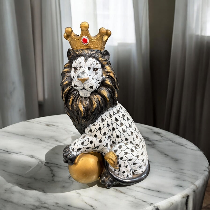 Black and White Crowned Lion Showpiece With a Golden Ball