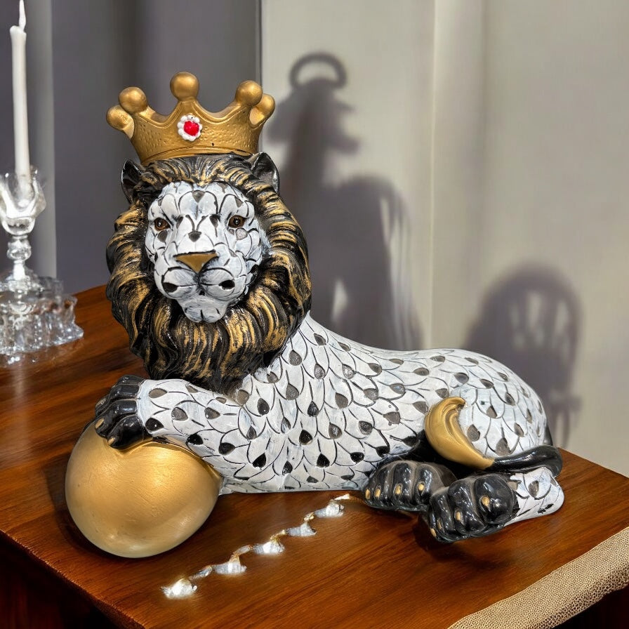 Black and White Crowned Lion Showpiece With a Golden Ball for Home Decor